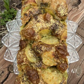 Sourdough Focaccia- Garlic scape pesto, potato, and pecorino cheese